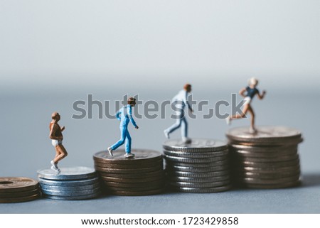 People running on Japanese coins Royalty-Free Stock Photo #1723429858