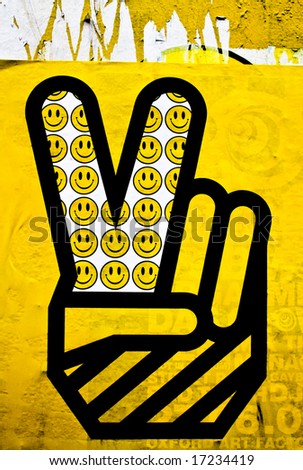 yellow graphic of hand peace symbol