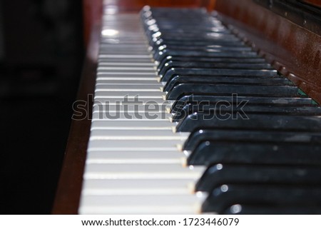 Keys of an old piano close-up. Selective shot.
