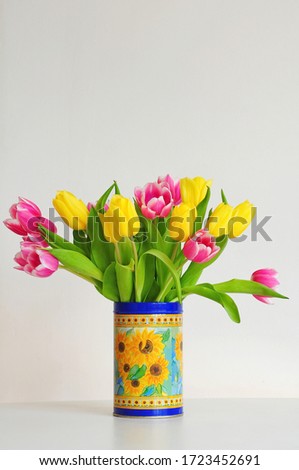 Beautiful bouquet of pink and yellow tulips. Holiday background.
