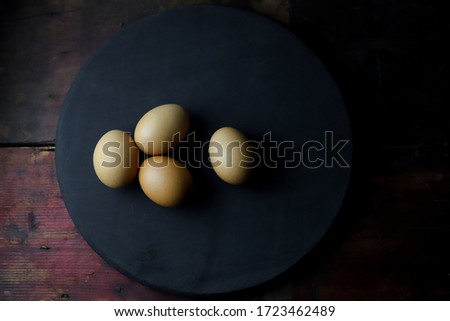 Many eggs placed on a black background