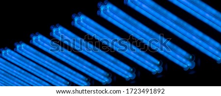  A lot of ultraviolet bulb turned on in the dark. UV-C ray. Germicidal lamps. Royalty-Free Stock Photo #1723491892
