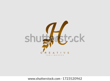 Letter H monogram floral wreath logotype golden color
