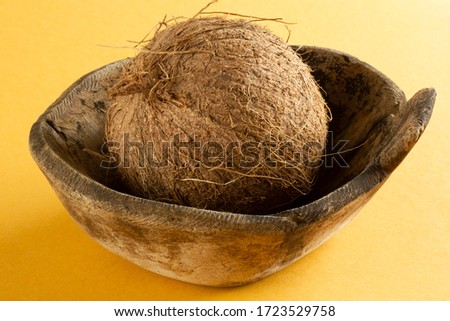 coconut in old antique wooden plate