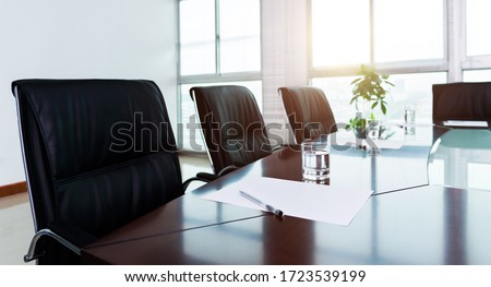White paper with pen in meeting room. Royalty-Free Stock Photo #1723539199