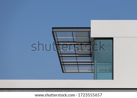 steel awning of modern house. exterior metal louver shading against blue sky. Royalty-Free Stock Photo #1723555657