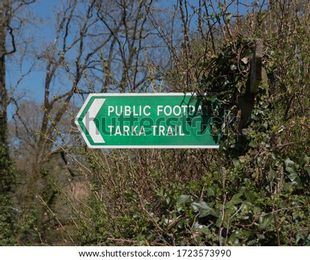 Sign Post for a Public Footpath on the Tarka Trail in a Hedgerow in Rural Devon, England, UK