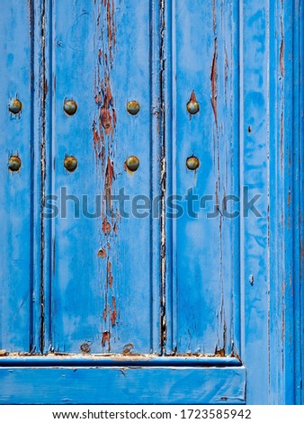 Old beautiful wooden door on Santorini island. Cyclades, Greece. Close up photo of texture
