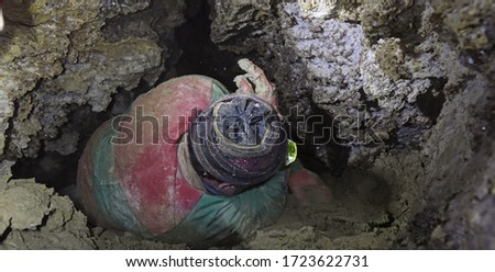 Caver works in a cave Royalty-Free Stock Photo #1723622731