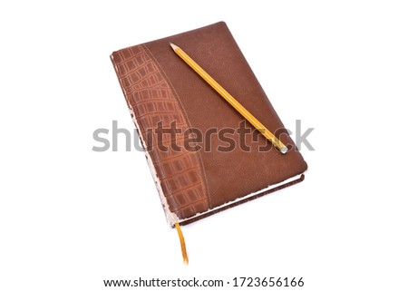 Old brown leather diary on a white background Royalty-Free Stock Photo #1723656166