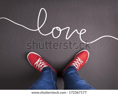  Original Valentines Day love concept with red sneakers and hand drawn text.