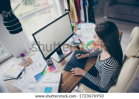 Top above high angle view portrait of her she nice attractive pretty focused successful seamstress needlewomen sitting in chair creating new dress collage choosing color at workplace workstation