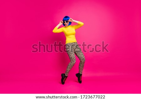 Full body photo of cool chilling lady students party rejoicing wear stylish retro specs yellow turtleneck blue wig footwear leopard trousers isolated bright shine pink color background