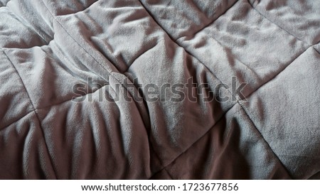 Use trace on grey blanket
 Royalty-Free Stock Photo #1723677856