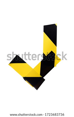 Letter J from yellow and black warning tape isolated on white background. Caution lines. Danger and risk sticky tape. Police stripe line. Industrial protection