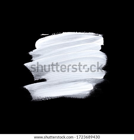 White brush painted acrylic isolated on black background