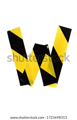 Letter W from yellow and black warning tape isolated on white background. Caution lines. Danger and risk sticky tape. Police stripe line. Industrial protection