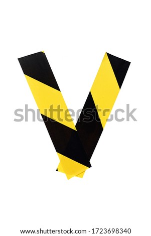 Letter V from yellow and black warning tape isolated on white background. Caution lines. Danger and risk sticky tape. Police stripe line. Industrial protection
