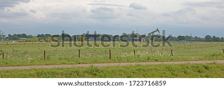 Landscape with oil pump jack, west germany