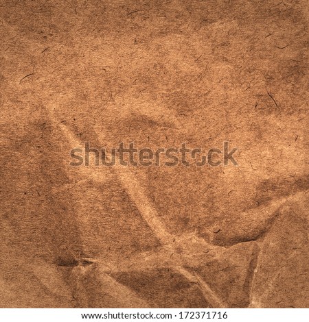 Designed  grunge paper texture.  Crumpled paper background. High resolution brown colored recycled  cardstock.