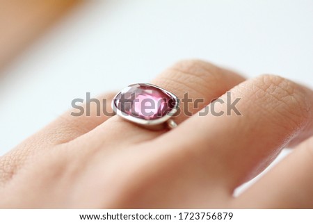 Gold silver ring wear on women hand skin with selective focus