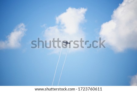 Airplane in the Blue sunny sky of Budapest.