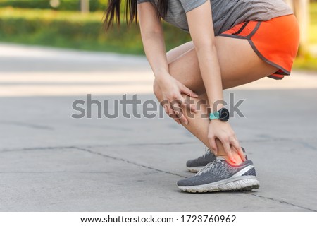 Achilles tendon tearing, a common running injury. pressure point. achilles tendon painful. Royalty-Free Stock Photo #1723760962