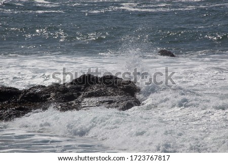 Ocean Surf against the rocks