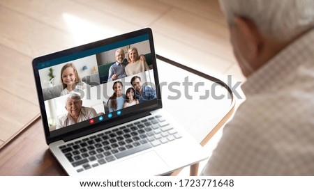 Close up of elderly man talk speak with diverse relatives on video call using modern tablet quarantine at home, mature grandfather have online web conversation conference with family on computer Royalty-Free Stock Photo #1723771648