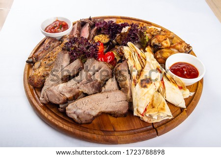 menu hot meat cut with sauce on a wooden Board Studio photo