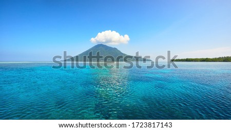 Beautiful panoramic view of the volcanic island of Manado Tua on a summer day. North Sulawesi, Indonesia Royalty-Free Stock Photo #1723817143