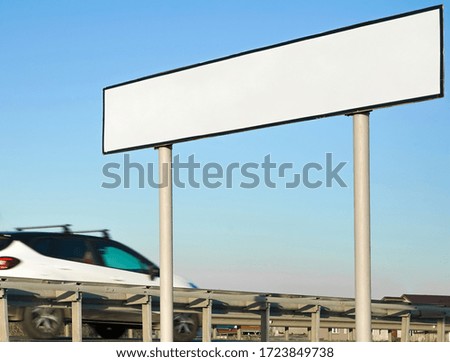 blank billboard or road sign on the highway. A winding paved country road
