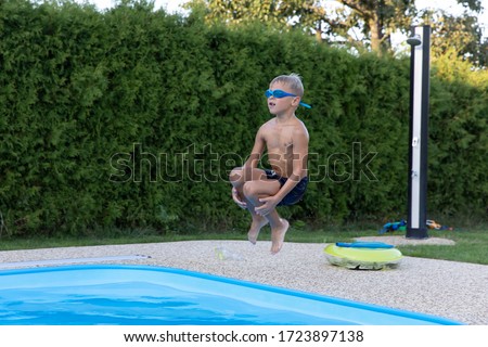 Boy jumping into the water. 