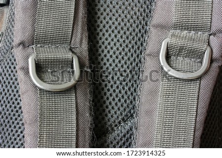 Straps of black tactical backpack