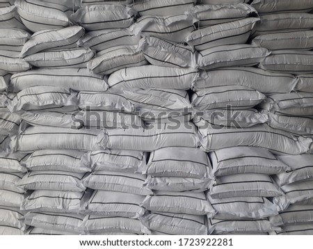 Chemical fertilizer The product stock is packed in sacks, stacked in the warehouse, waiting for delivery.	