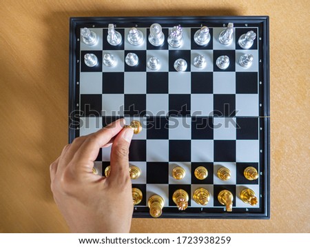 Top view of chess game on chessboard. Business game competitive strategy. Concept of strategic for business.