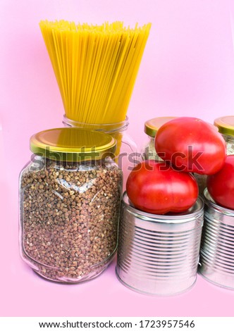 Stock of products at the time of quarantine. Jars of rice, buckwheat, canned goods, tomatoes, pasta. Food storage for a long time. Donation. Quarantine, isolation, coronavirus.