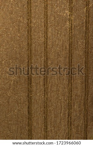 Golden crumpled texture of paper wallpaper with stripes