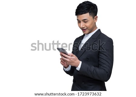 Portrait of Young Asian businessman holding mobile phone and smiling on white background with clipping path