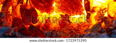 red hot coals in a blast furnace for metal melting. metal mining and processing industry. Red coals from a burnt fire made of wood. panoramic