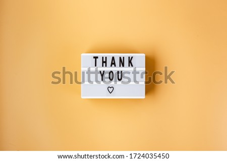 Creative Top view flat lay lightbox with the text of thanks of the heroes, thanking the doctors, nurses and medical staff working in hospitals during the COVID-19 coronavirus pandemic