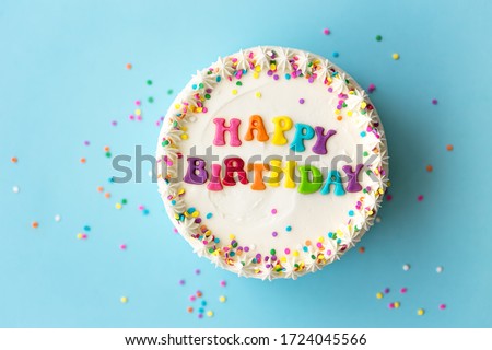 Happy birthday cake with rainbow lettering Royalty-Free Stock Photo #1724045566