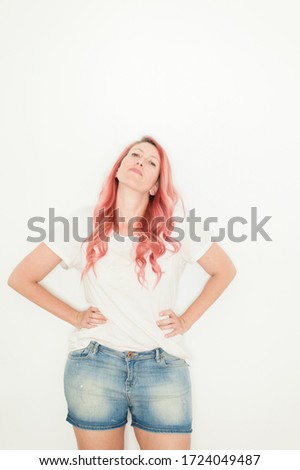 Pink haired woman portrait at home