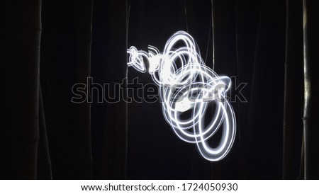Alphabet Light painting and design by long exposure photography in the dark.