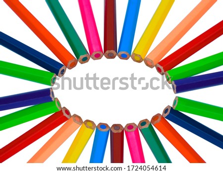 Different colored wood pencil crayons making a nice round circle on a white isolated background
