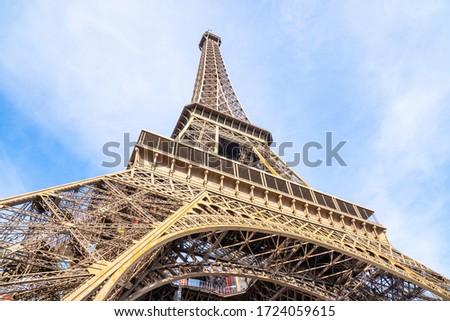 Eiffel Tower with blue sky background closeup view