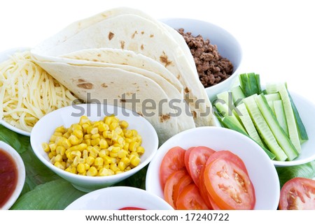 A layout of taco ingredients isolated on white