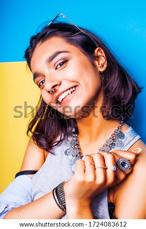 lifestyle people concept. young pretty smiling indian girl with long nails wearing lot of jewelry rings, asian summer happy cool close up