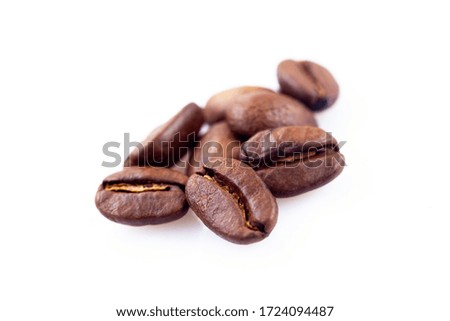 Roasted coffee beans brown  close up ,isolated in white background