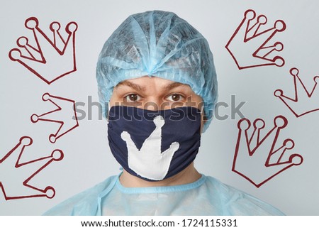 A man in a protective mask with a picture of the crown. Coronavirus protection concept